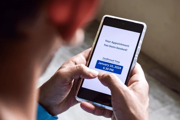 south-asian-man-checking-smartphone-600nw-2386341065